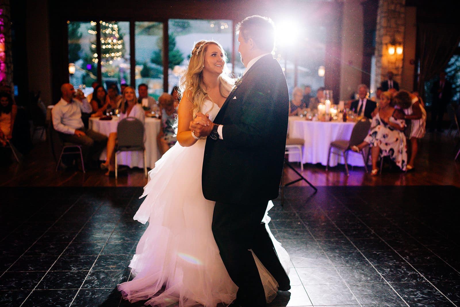 A man and woman dancing on the dance floor.